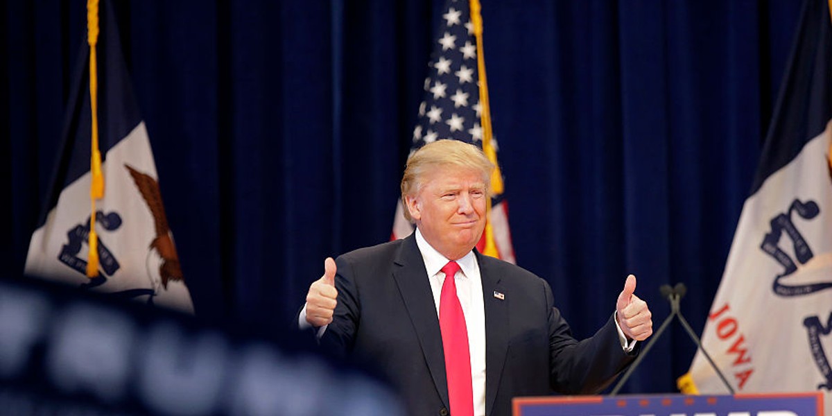 Republican presidential candidate Donald Trump gives a thumbs-up as he is introduced during a campaign event.