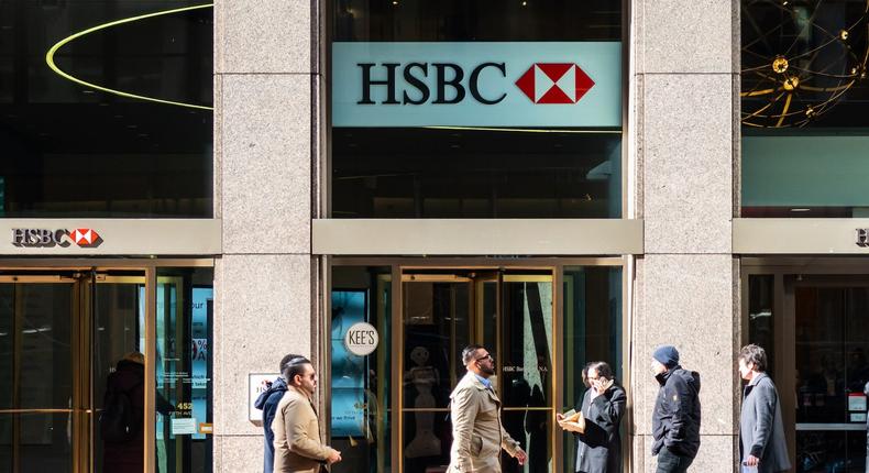 Pedestrians walk past a branch of the British multinational banking and financial services holding company, The Hongkong and Shanghai Banking Corporation, or HSBC, in New York City.