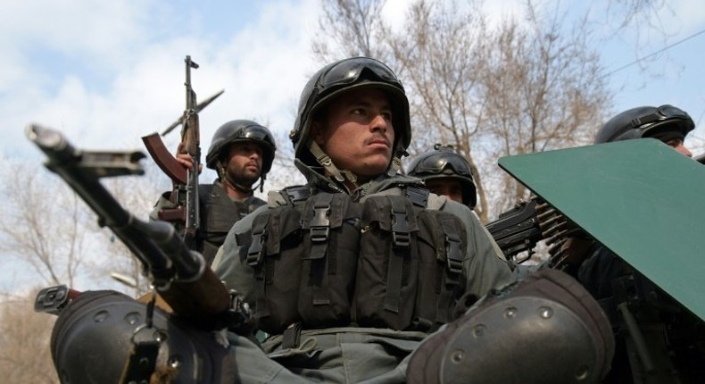 Afghan policemen arrive at the site of a terror attack in Kabul, on March 8, 2017