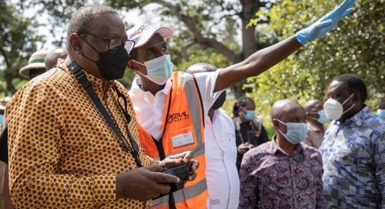 President Uhuru Kenyatta flies a drone in Kilifi County 