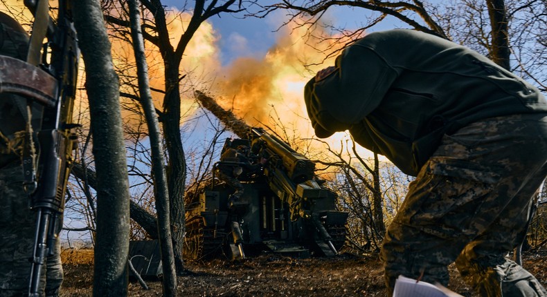 Ukrainian soldiers fire a self-propelled howitzer towards Russian positions near Bakhmut on March 5, 2023.Libkos/AP Photo