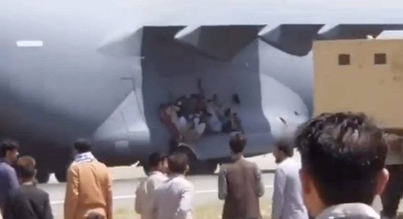 Social-media footage apparently showing people clinging onto a jet leaving Kabul airport on August 16, 2021.
