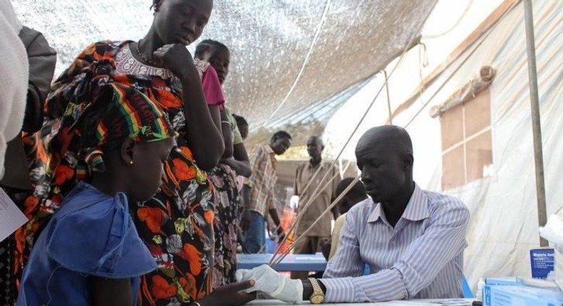 A displaced girl is tested for malaria at an MSF clinic in Tomping camp, where some 17,000 displaced people who fled their homes are being sheltered by the United Nations, in Juba , in a file photo. REUTERS/Andreea Campeanu