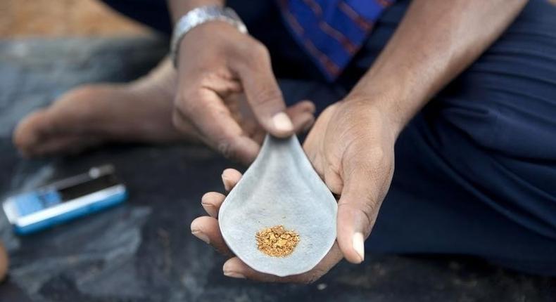 Amadou Dabo, 46, displays roughly seven grams of gold he bought from small-scale miners for about $30 in Kalana, August 25, 2012.REUTERS/Joe Penney