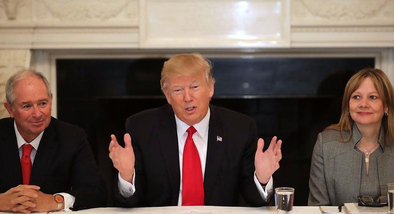 President Donald Trump, center, sits next to Blackstone CEO Stephen Schwarzman and GM CEO Mary Barra at the first meeting of the Strategic & Policy Forum on Feb. 3, 2017.