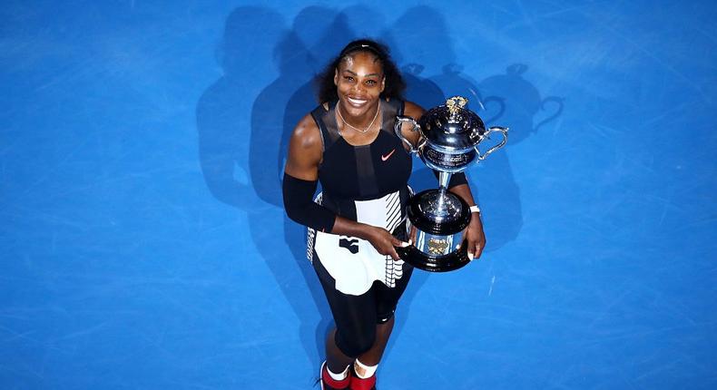 Serena Williams holds the Australian Open trophy.