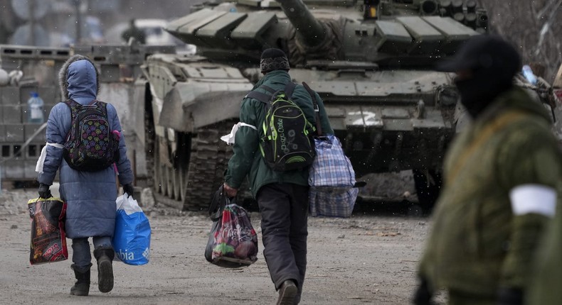 Civilians trapped in Mariupol city under Russian attacks, are evacuated in groups under the control of pro-Russian separatists, through other cities, in Mariupol, Ukraine on March 20, 2022.