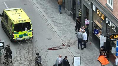Ambulance in a street near the site were a truck was driving into a crowd in central Stockholm