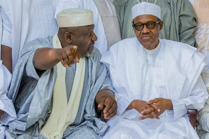 Rochas Okorocha (left) and President Muhammadu Buhari [The Sun Nigeria] 