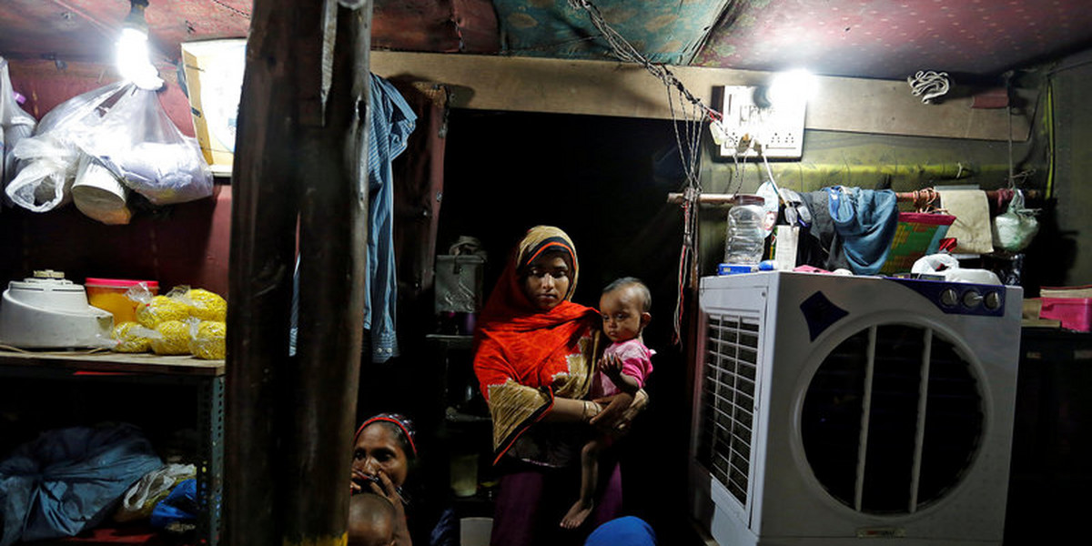 Rohingya Muslims flee after more than 2,600 houses were burned down in their Myanmar community
