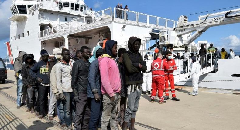 Migrants and refugees arrive in the port of Messina in Sicily following a rescue operation at sea by the Italian coastguard ship 'Diciotti', in March 2016