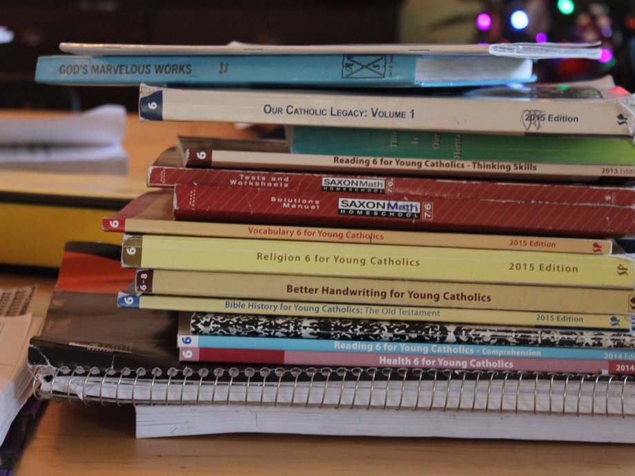 Workbooks sit in piles on the Kelleys' dining-room table.