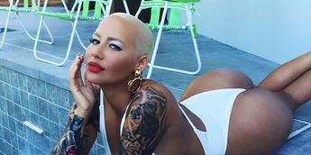 Amber Rose shows buttocks in white thong swimsuit
