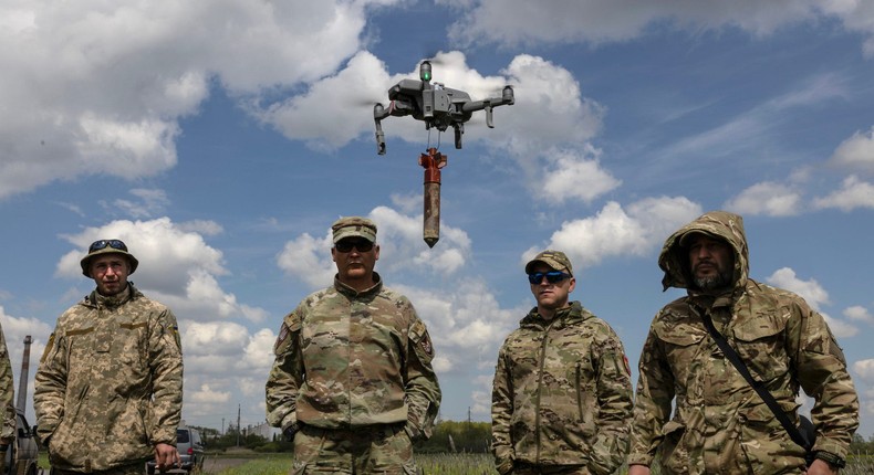 Ukrainian military members learn to fly drones with bombs attached in May 2023 in Ukraine's Lviv region.Paula Bronstein /Getty Images