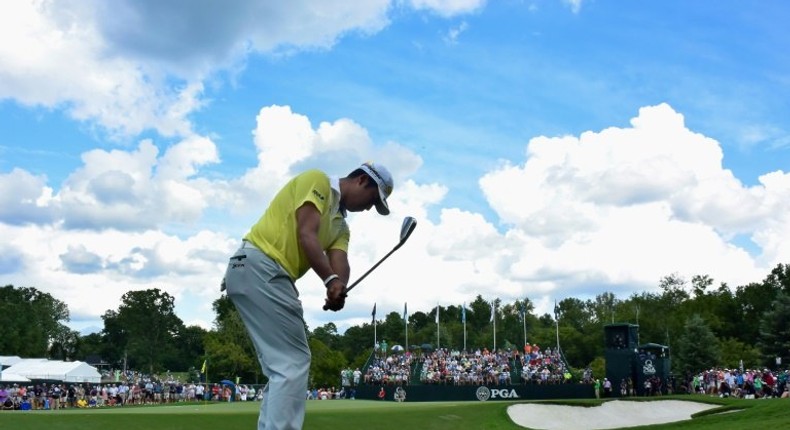 Hideki Matsuyama of Japan plays his shot on the ninth hole during the third round of the 2017 PGA Championship at Quail Hollow Club in Charlotte, North Carolina, on August 12, 2017