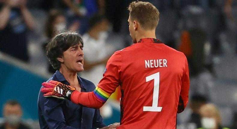 Germany head coach Joachim Loew celebrates with  goalkeeper Manuel Neuer after reaching the last 16 of Euro 2020 with a 2-2 draw against Hungary Creator: KAI PFAFFENBACH