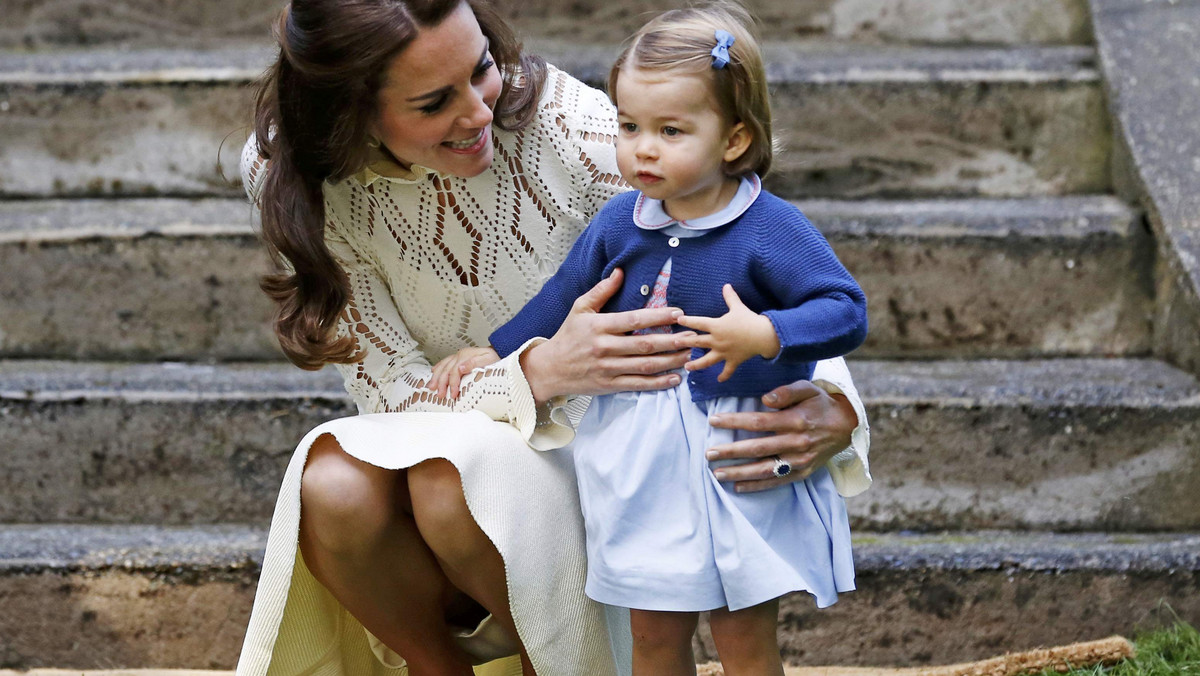 Britain's Catherine, Duchess of Cambridge, speaks to Princess Charlotte as they arrive at a children's party at Government House in Victoria