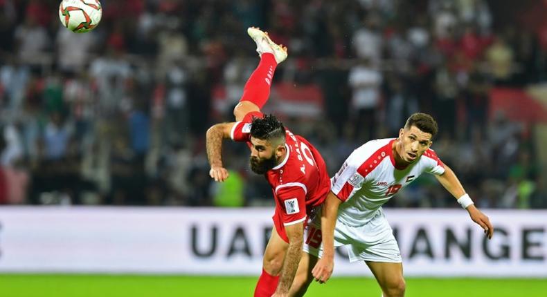 Defender Ahmad Al Saleh (left) blames former coach for Syria's problems at Asian Cup