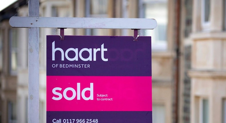 A estate agent's board is seen outside a property on October 8, 2014 in Bristol, England.