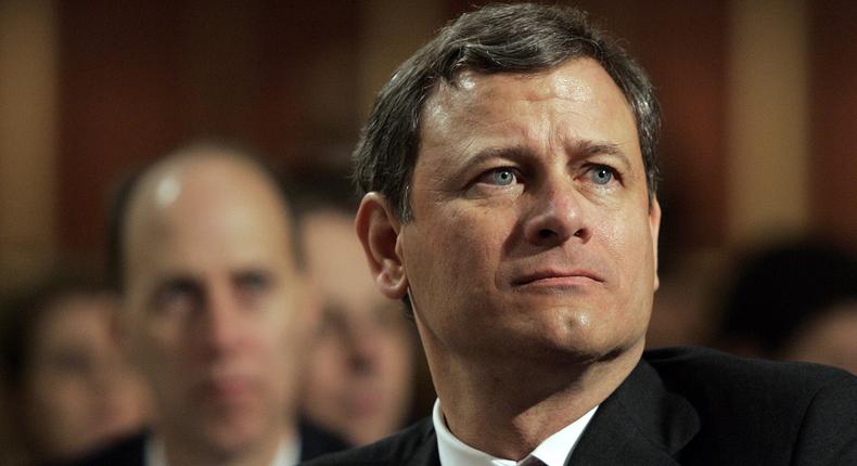 Supreme Court Chief Justice John Roberts listens as President Bush speaks at the National Prayer Breakfast in Washington Friday, April 7, 2006.