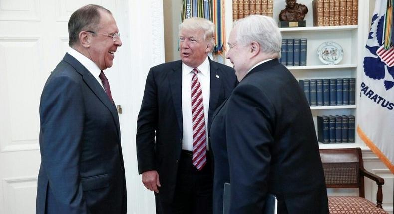 US President Donald J. Trump (centre) speaks with Russian Foreign Minister Sergei Lavrov (left) and Russian Ambassador to the U.S. Sergei Kislyak during a meeting at the White House in Washington DC, on May 10, 2017