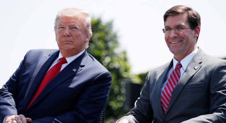 President Donald Trump, left, sits with Secretary of Defense Mark Esper, during a full honors welcoming ceremony for Esper at the Pentagon, Thursday, July 25, 2019, in Washington.