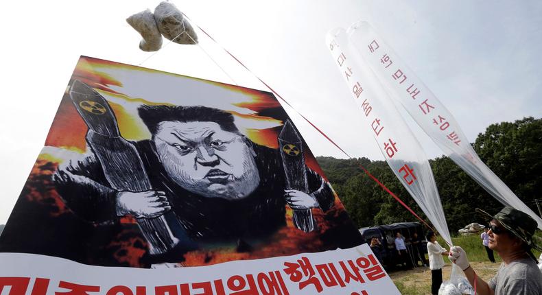 North Korean defectors prepare to release balloons carrying leaflets and a banner denouncing North Korean leader Kim Jong Un in Paju, near the border with North Korea,, on September 15, 2016.AP Photo/Ahn Young-joon, File