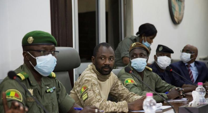 Colonel Assimi Goita, centre, has been granted presidential-like powers as head of the new junta, according to a document posted on Mali's official gazette