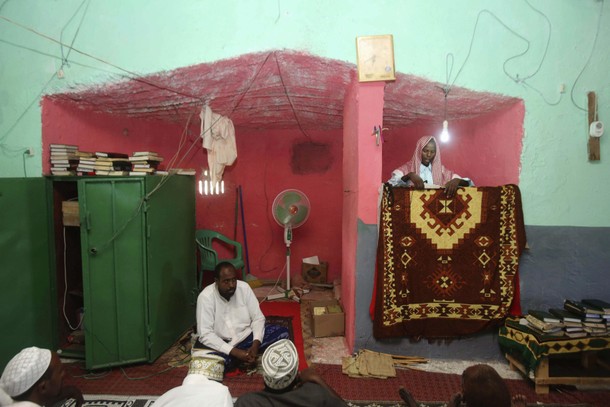 The Imam (prayer leader) recites a speech to the congregation before Friday prayers at a mosque in t