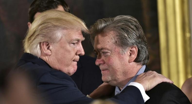 US President Donald Trump (left) congratulates Steve Bannon during a ceremony at the White House in January 2017