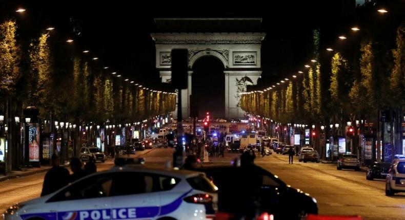 The gunman opened fire on a police van just a few hundred metres from the iconic Arc de Triomphe