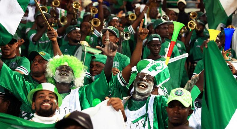 Nigeria supporters in Garoua celebrate qualifying for the second round of the Africa Cup of Nations. Creator: Daniel BELOUMOU OLOMO