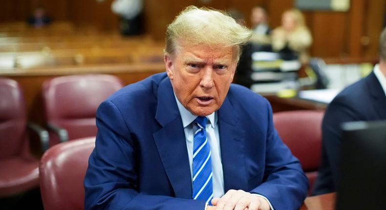 Former U.S. President Donald Trump sits in the courtroom as he awaits the start of the second day of his criminal trial at Manhattan Criminal Court.AP