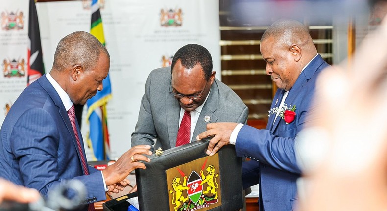 Treasury CS Njuguna Ndung'u with PS Chris Kiptoo having a look at Kenya's budget briefcase