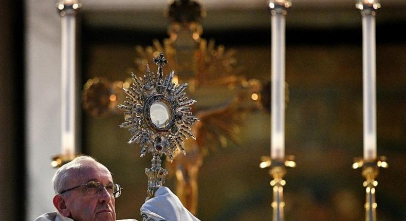 Pope Francis celebrates mass after a procession through Rome, on June 18, 2017