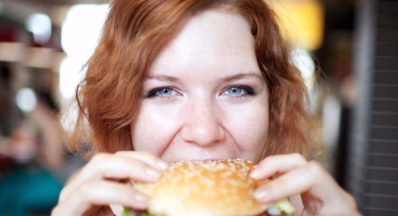 girl eating a burger hungry appetite 12