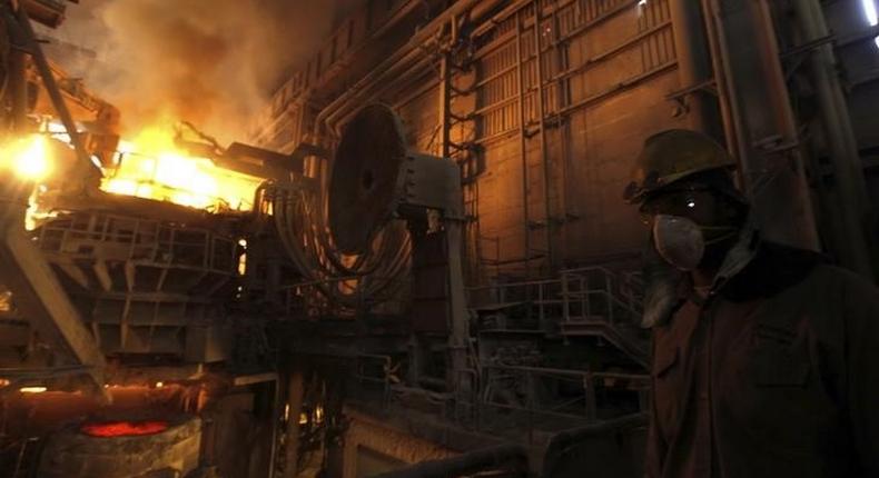 A worker operates a furnace at a factory belonging to Ezz Steel, Egypt's largest steel producer, at an industrial complex in Sadat City, 94 km (58 miles) north of Cairo, April 17, 2013. REUTERS/Amr Abdallah Dalsh