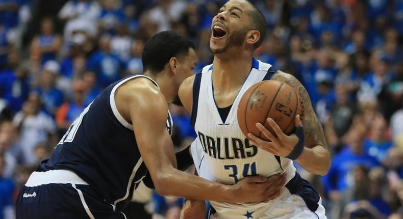 Devin Harris of the Dallas Mavericks is fouled by Andre Roberson of the Oklahoma City Thunder during game four of the Western Conference Quarterfinals of the 2016 NBA Playoffs at American Airlines Center on April 23, 2016 in Dallas, Texas