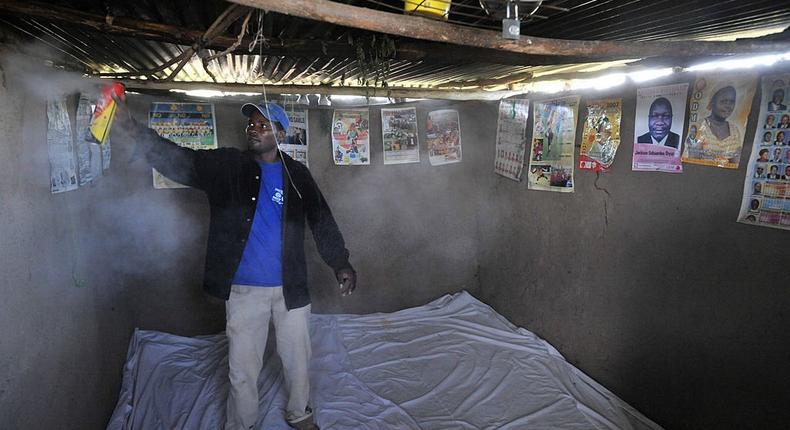 KENYA - FEBRUARY 20: A staff of Nagasaki University research team spray pesticide to count the number of mosquitoes inside the house on February 20, 2008 in Kenya. (Photo by The Asahi Shimbun via Getty Images)
