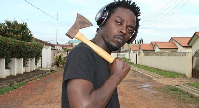 Kwaw Kese with an axe