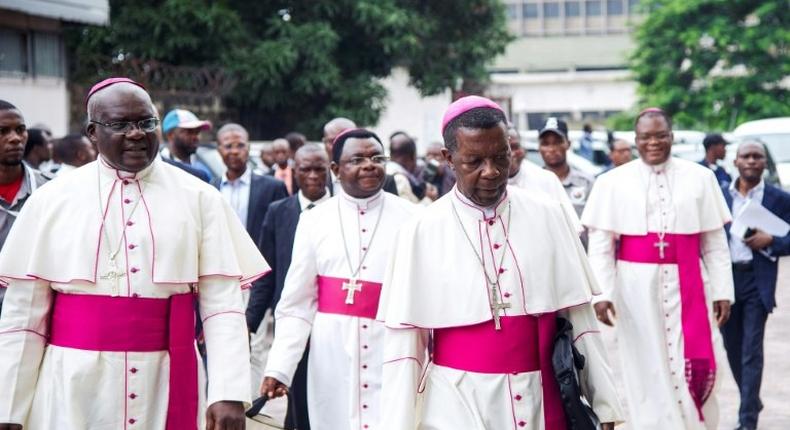 Catholic bishops arrive for the signing of an accord at the inter diocesan centre in Kinshasa on January 1, 2017 following talks launched by the Roman Catholic Church between the government and opposition