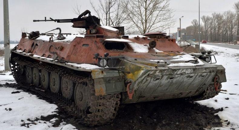 A destroyed Russian military vehicle is seen on the roadside on the outskirts of Kharkiv on February 26, 2022, following the Russian invasion of Ukraine.