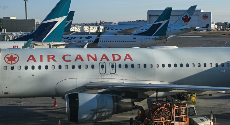 An Air Canada jet parked on the runway.Artur Widak/NurPhoto via Getty Images