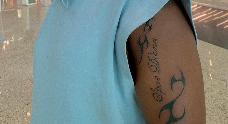 Spice Diana's manager shows off tattoo of her brand name