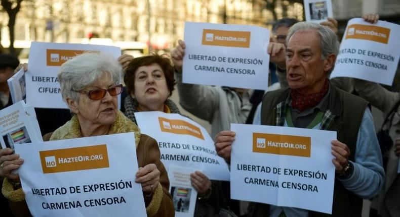 Members of the HazteOir (Make yourself heard) association protest in Madrid on March 1, 2017 against the immobilisation by the police of their anti-transgender propaganda bus