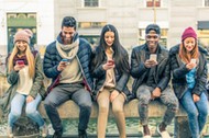 Multiracial group of people with cellphones