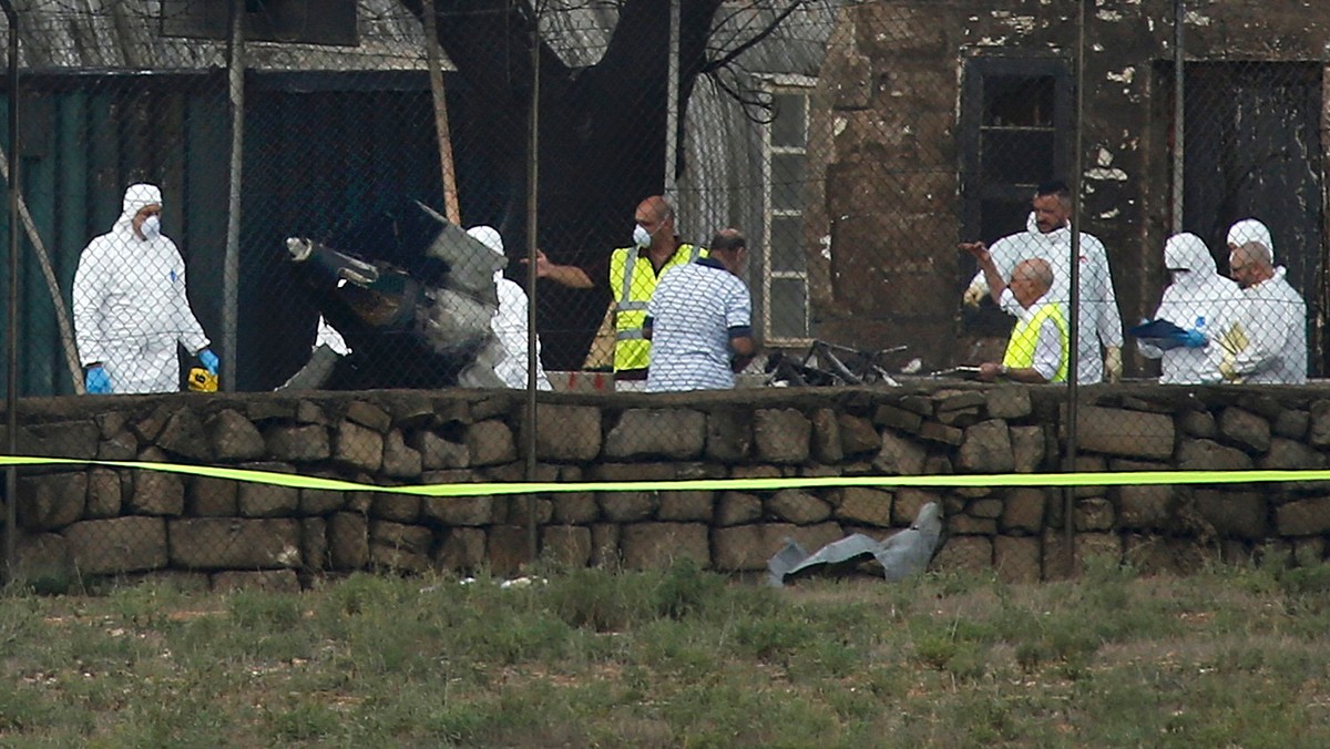 Investigators and rescue services at scene of plane crash at Valetta airport in Malta