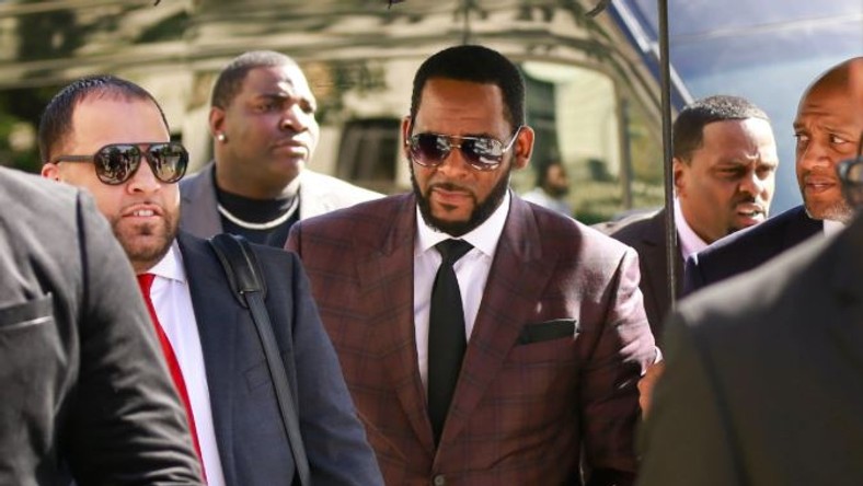 R.Kelly's woes appear to be compounding following the new charge levelled against him for bribery over a fake identity to marry the late Aaliyah.[ViceNews]