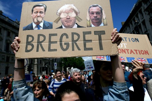 People hold banners during a demonstration against Britain's decision to leave the European Union, i