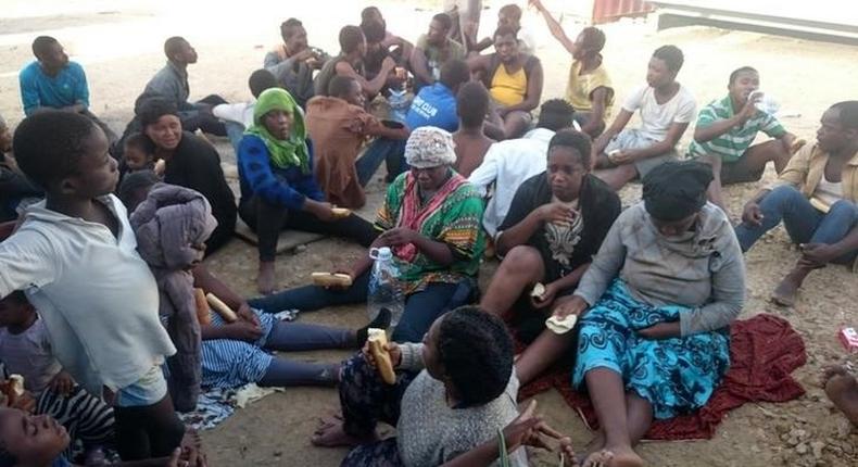 Migrants, who were rescued by the Libyan coastguard after their boat sank off the coastal town of Garabulli, rest east of Tripoli, Libya October 3, 2016. Picture taken October 3, 2016. REUTERS/Stringer